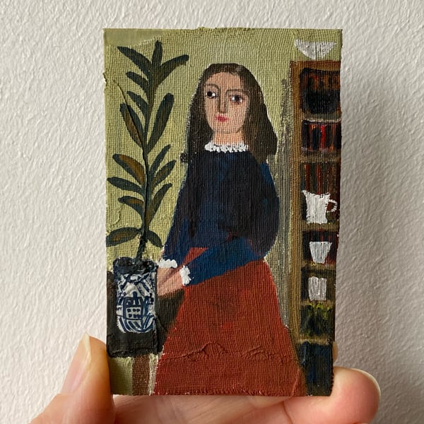 Image of Woman in interior with houseplant - tiny painting 