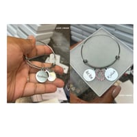 2 sided name charm, best mom charm, and one additional charm of choice ( Available in silver & gold)