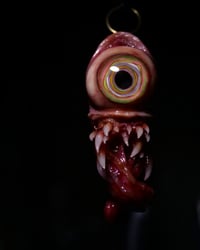 Image 1 of Color Burst Twisted tongue pendant, OOAK green purple orange blue Glow