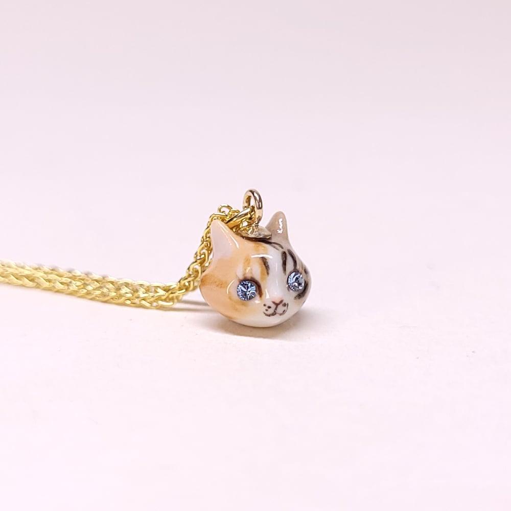 Image of Tabico Porcelain & Gold Vermeil Teeny Tiny Cat Pendant