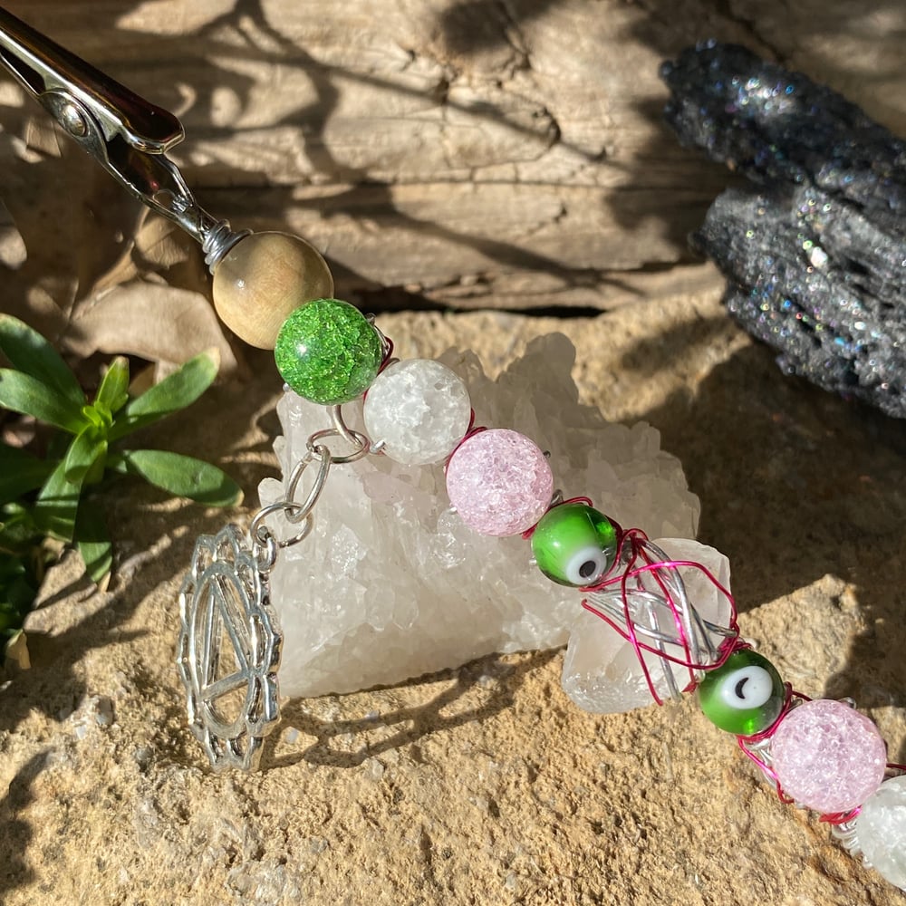 Image of pink leaves roach clip