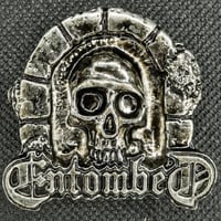 Entombed skull pin