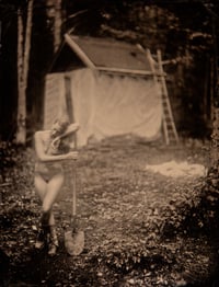Sofia leaning on shovel