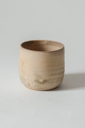 Image of teacup in sandstone