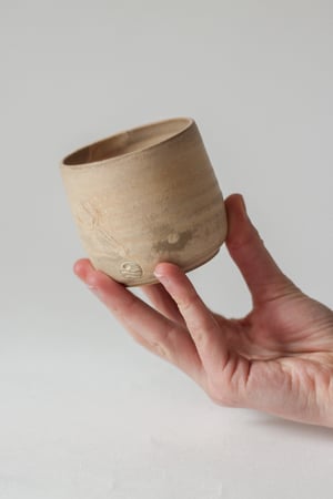 Image of teacup in sandstone