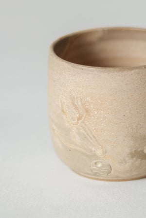 Image of teacup in sandstone