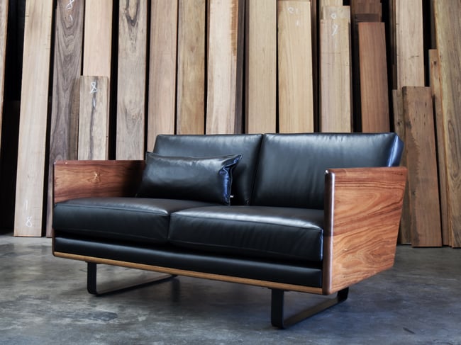 CLOVER COUCH IN TASMANIAN BLACKWOOD WITH  BLACK LEATHER