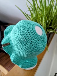 Bucket style hat with a hole.