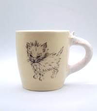 Image 1 of This kitty woke up and craves chaos (and a cig)