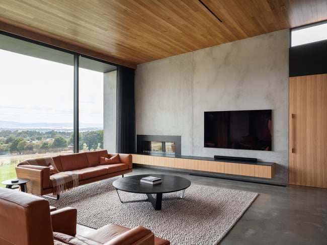 CLOVER COUCH IN TASMANIAN OAK WITH UPHOLSTERED SIDES IN TOBACCO LEATHER