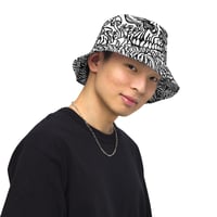 Image 3 of "Reversible Australian flowers and skull" bucket hat