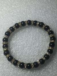 Image 1 of Black beaded bracelets with gold spacers