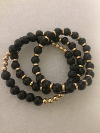 Image 3 of Black & Gold bracelets