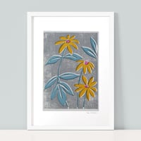 Image 1 of Yellow Rudbeckia - blue leaves and textured ground