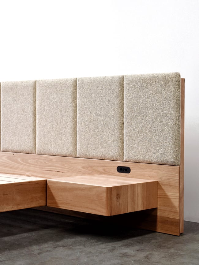 FLOATING BED WITH UPHOLSTERED BED HEAD AND SOFT CLOSE DRAWERS IN BLACKBUTT