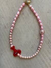 Pink pearls necklace with crab 