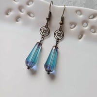 Image 1 of Art deco bronze floral cut out earrings handmade with faceted transparent aqua Czech glass drops