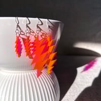 Image 3 of Neon Pink Transparent Grateful Dead 13-Point Bolt Earrings