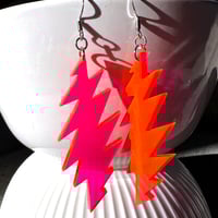 Image 1 of Neon Pink Transparent Grateful Dead 13-Point Bolt Earrings