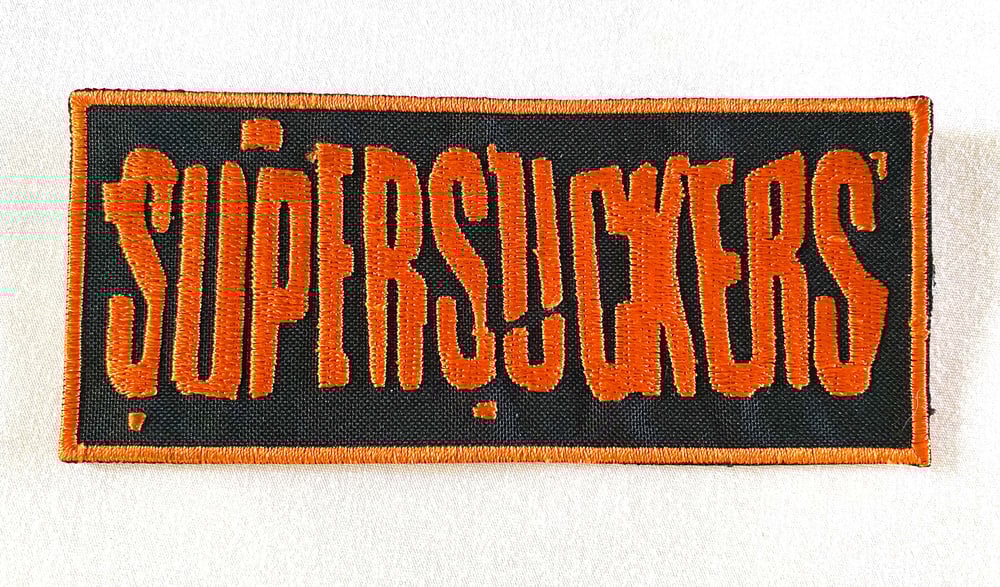 Image of SUPERSUCKERS - 5X11CM - AUSSIE TOUR PATCH. BLACK AND ORANGE PATCH