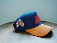 Image 2 of Navy blue corduroy with a tan brim 