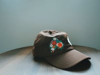 Image 1 of Chocolate brown dad hat. 