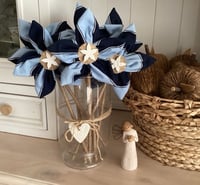Image 1 of Memory Flowers custom created from a two tone blue polo shirt