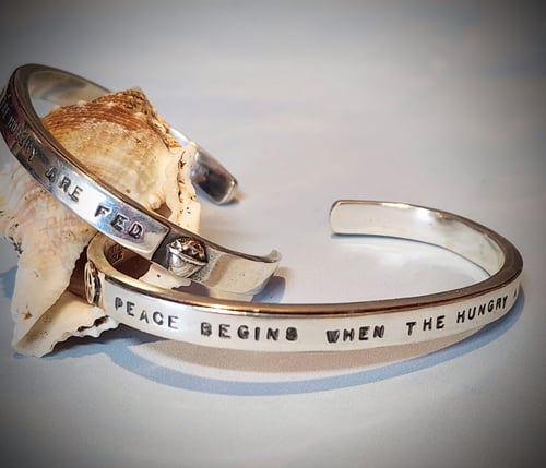 Image of "Peace Begins When the Hungry Are Fed"