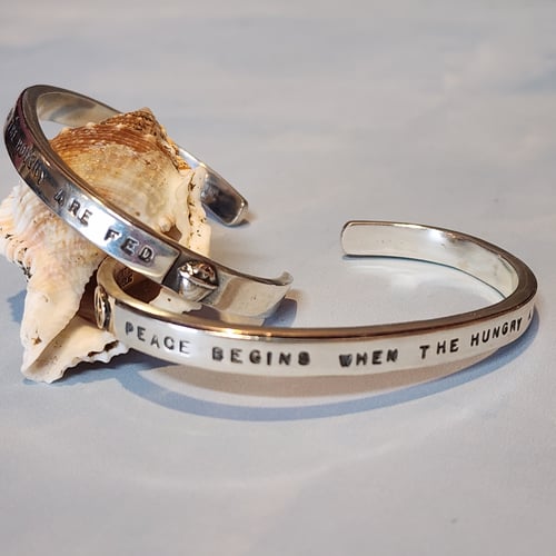 Image of "Peace Begins When the Hungry Are Fed"