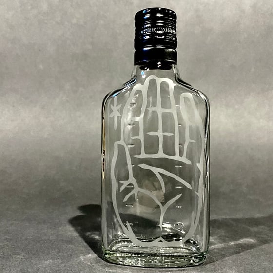 Image of hand moniker acid etched bottle