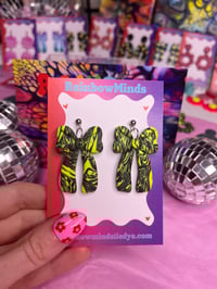 Neon zebra bow earrings 