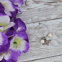 Image 3 of White Moth Wine Glass Charm