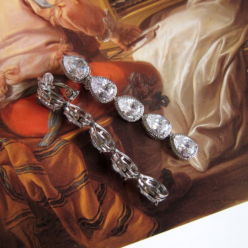 Image of Frostpetal clip-on dangle earrings