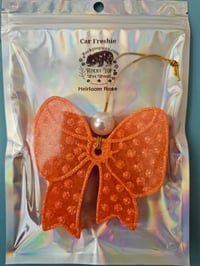 Image 2 of Orange Coquette bow car freshie scented in Heirloom Rose 