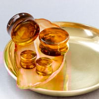 Image 1 of Smoke Plugs - Epoxy Resin - Round - 6mm - 50mm - Amber and Coffee - Custom Plugs for Stretched Ears 