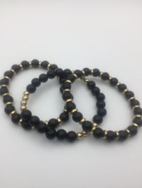 Image 5 of Black & Gold bracelets