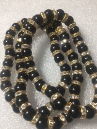 Image 2 of Black beaded bracelets with gold spacers
