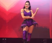 Image 2 of RING WORN Billie Kay purple gear