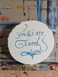 Image 2 of You and I are earth text on woodslice