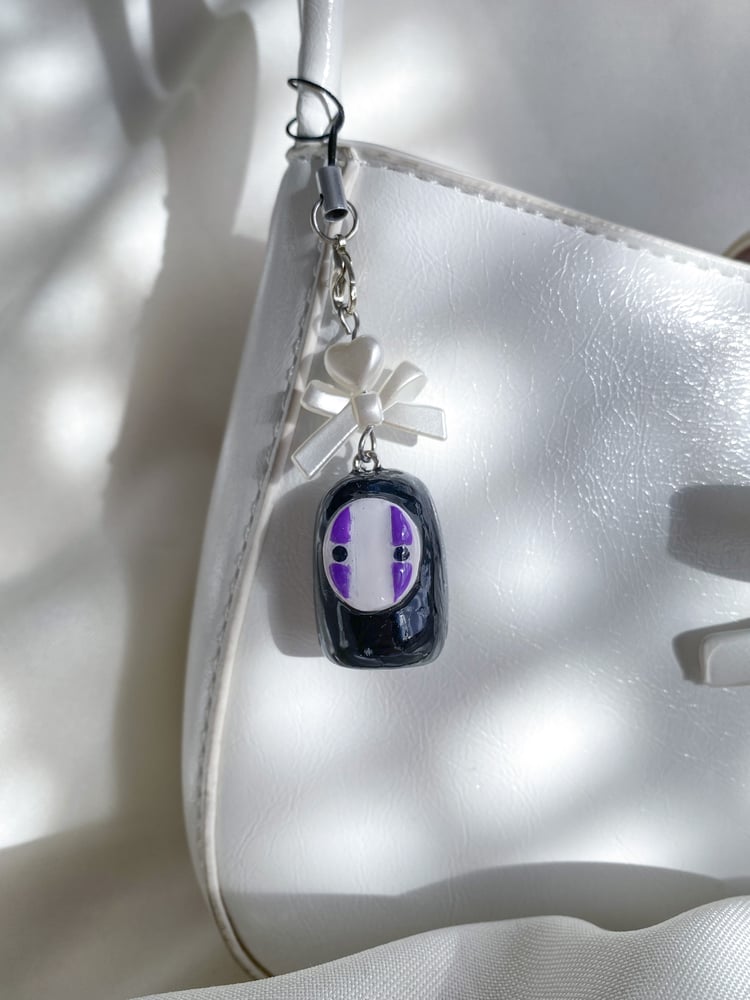 Image of no face charm