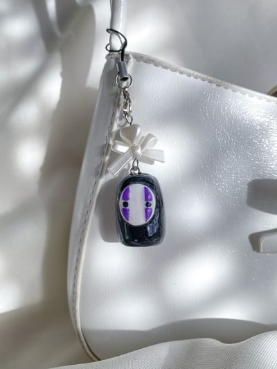 Image of no face charm