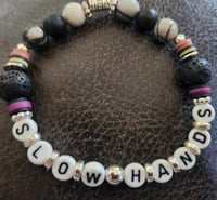 SLOW HANDS SONG TITLE BRACELET