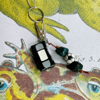 Image 2 of out there keychain