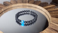 Image 1 of Evil Eye Lava Rock Bracelet