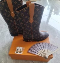 Image 1 of LV Boots on the Ground 