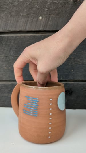 Image of 16 oz Geometric Mug on Red Clay