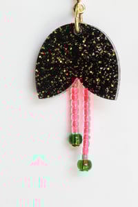 Image 3 of Dangly glittery black flowers with pistils earrings
