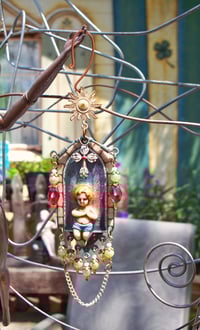 Image 4 of "Beloved Son of God" earrings or ornaments with stained glass windows and lots of jewels.