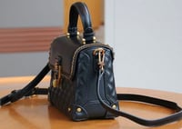 Image 2 of Fashionable woman’s 2025 handbag.