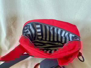 Image of Bright Red fanny pack with Grinning patch
